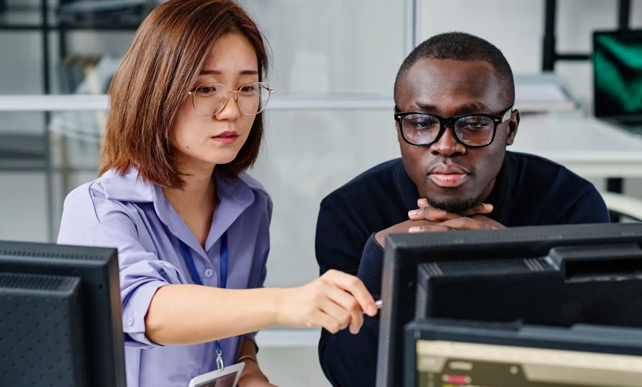 Colleagues Looking At Screen