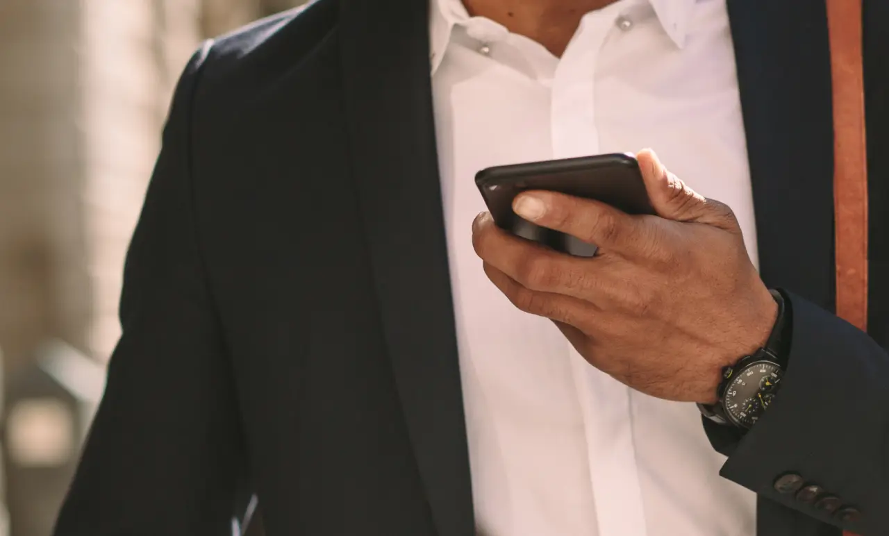 Traveler With Phone In His Hand