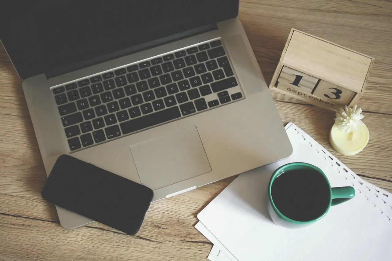Turned-off Macbook Pro Near a Cup of Coffee pexels-александар-цветановић-1422292