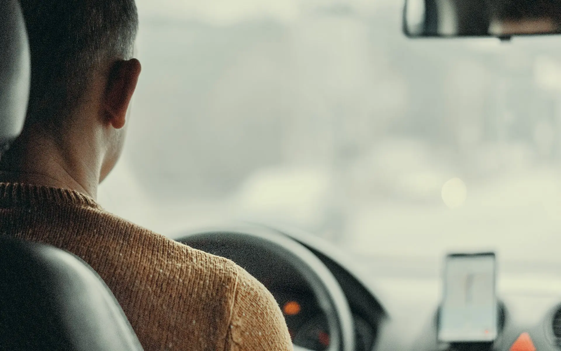 Man driving car Viktor Bystrov qd zd2MoeE8 unsplash