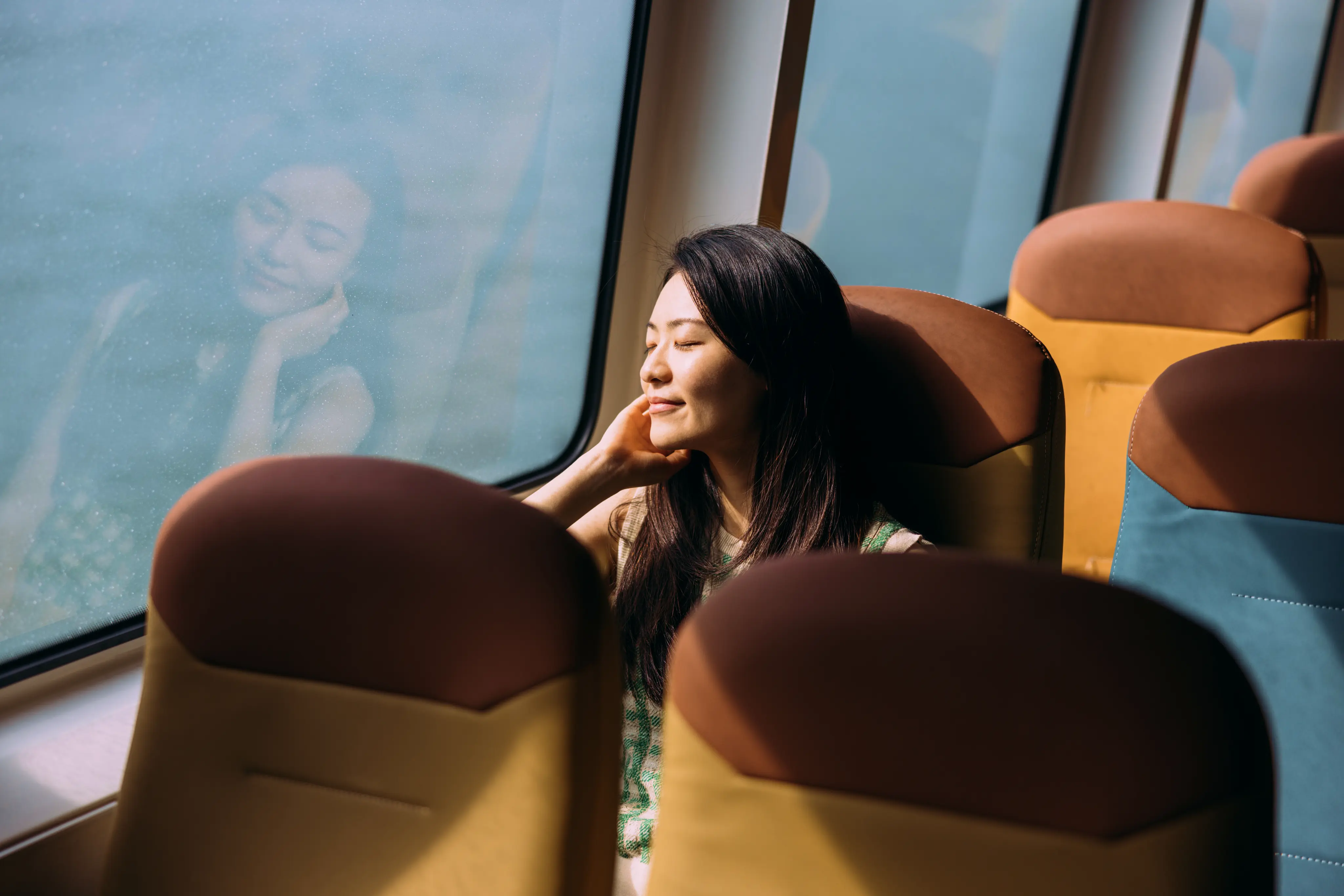 Woman Relaxing By A Window
