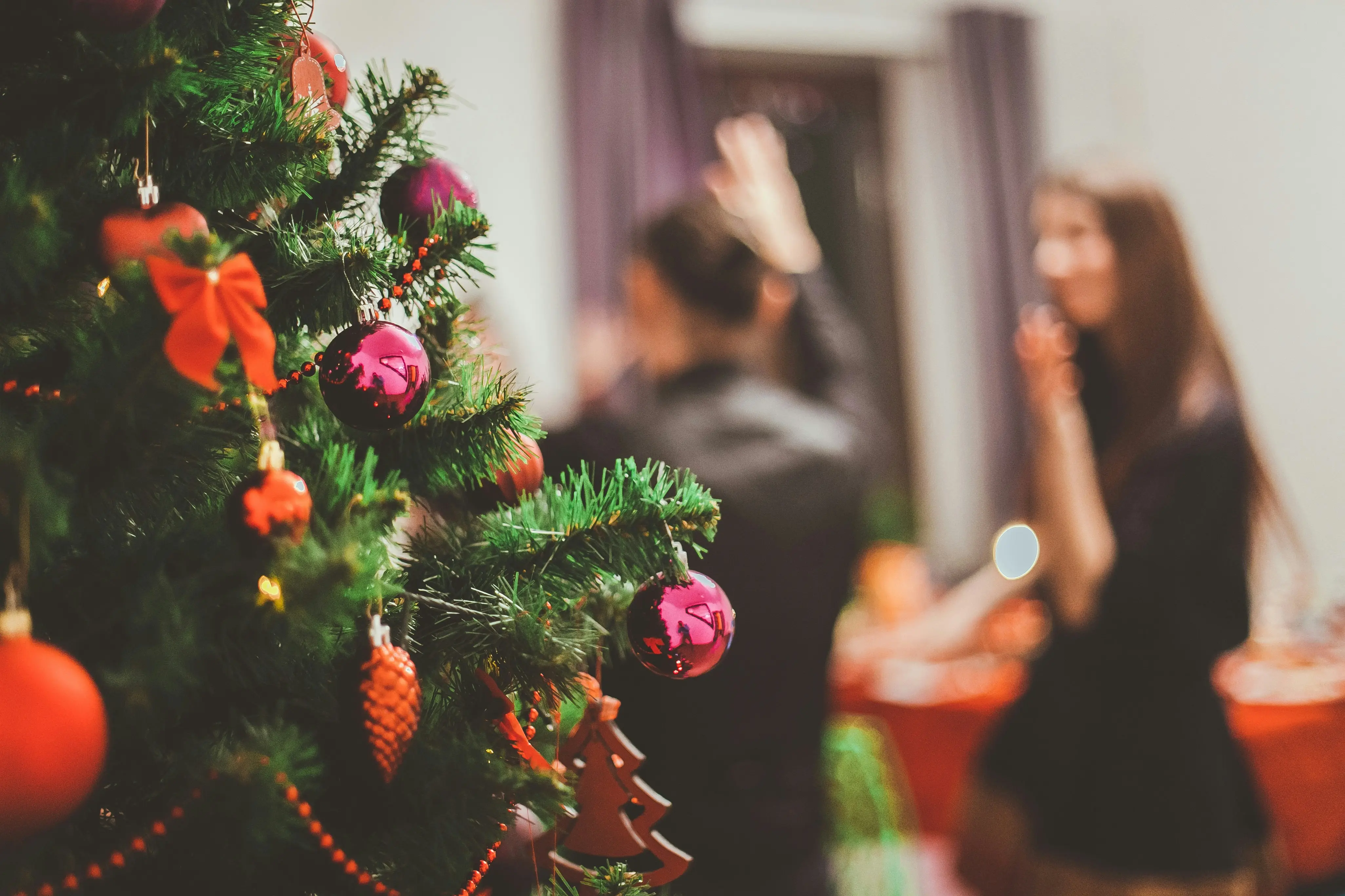 Christmas Tree With People In The Background