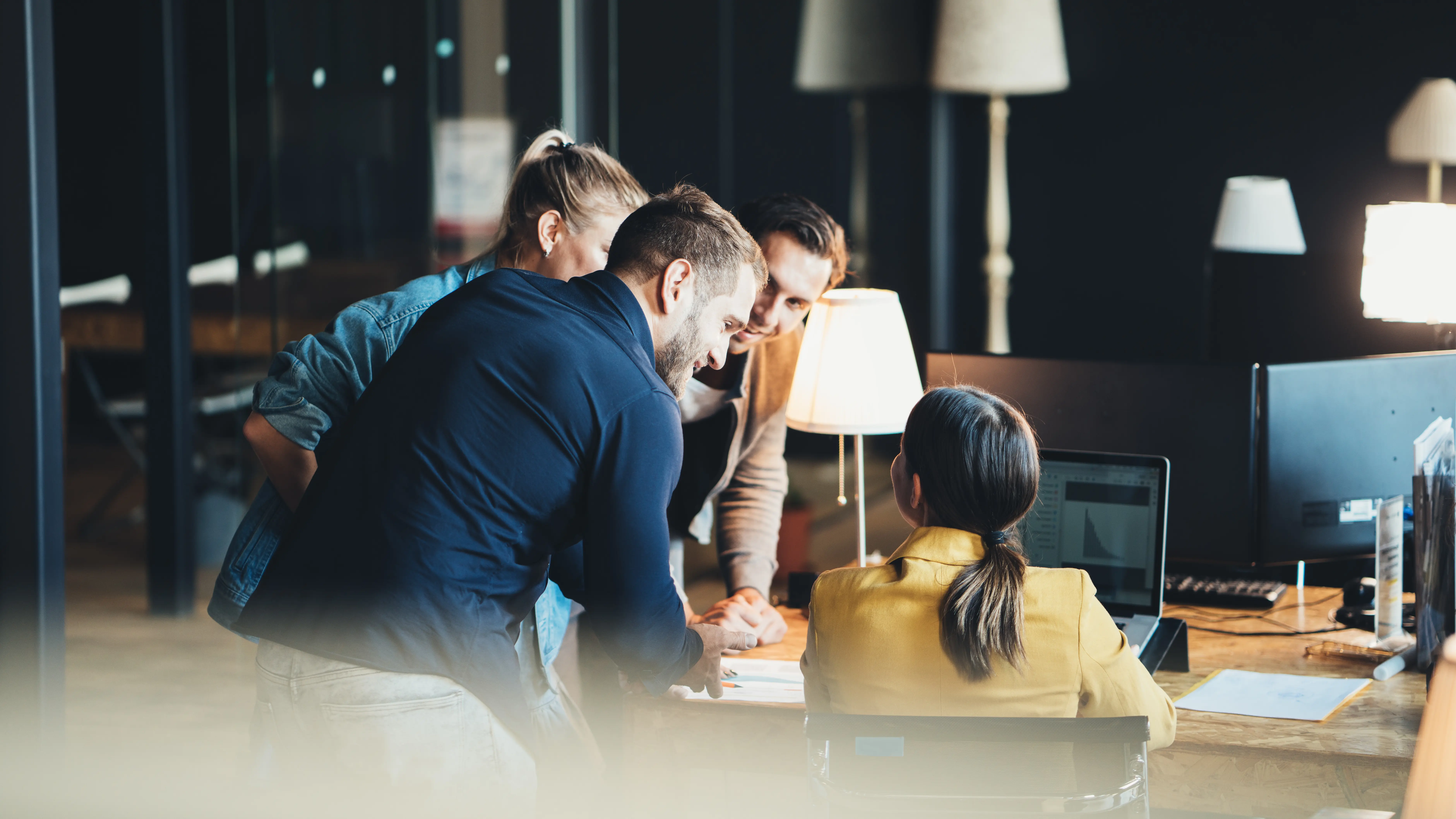 People Working Together On Laptop