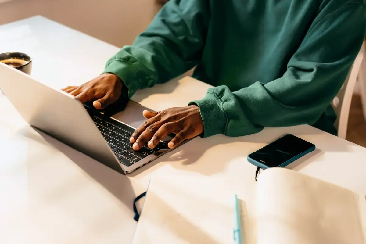 Man With Hands On Laptop