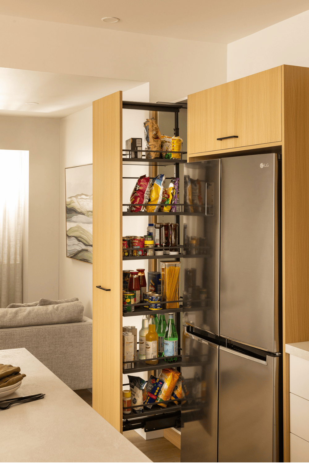 Kaboodle kitchen pantry organisation, featuring light timber doors and panels