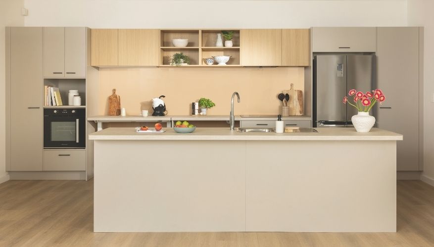 Modern, accessible kitchen with wide layout, easy-reach cabinets, and integrated appliances.