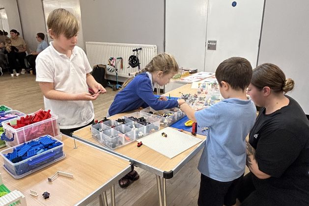 Children in Brick club building with LEGO bricks