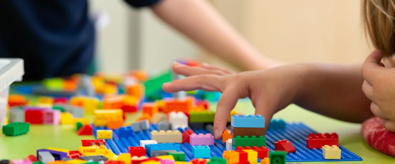 Children playing with Lego Bricks