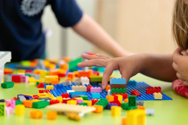 Children playing with Lego Bricks