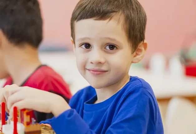 Boy playing with Lego Bricks at Brick Club
