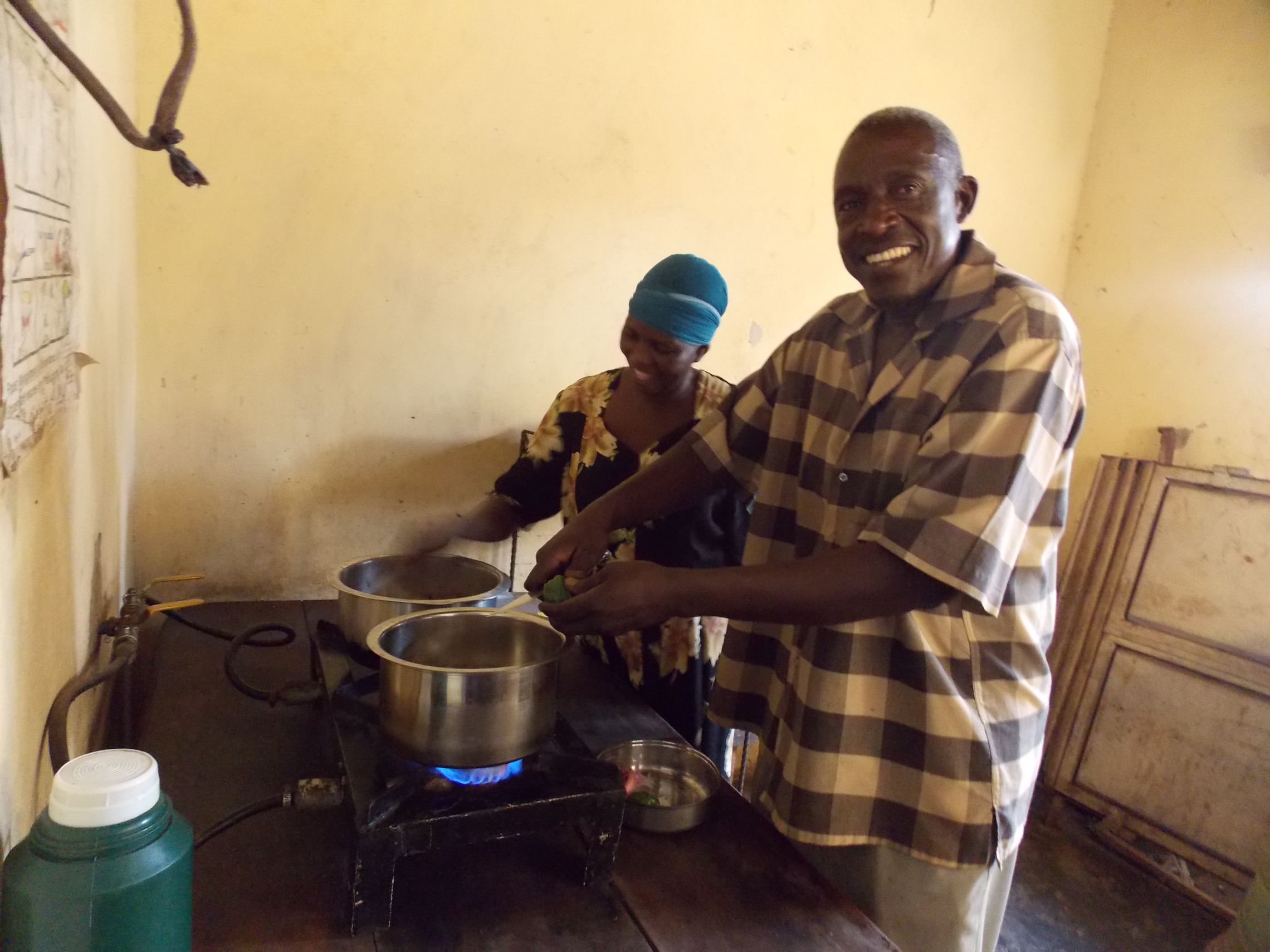 The Watalungas happily preparing food in their kitchen