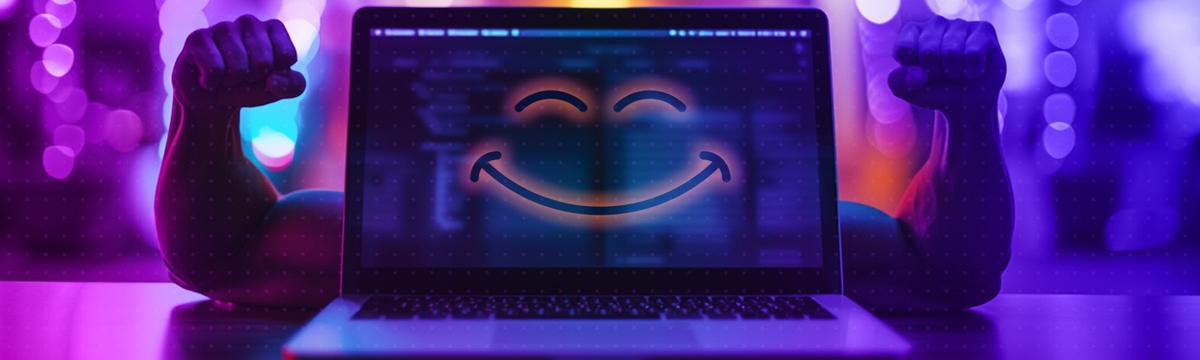 A laptop with muscular arms coming out from behind and a smiley face on the screen