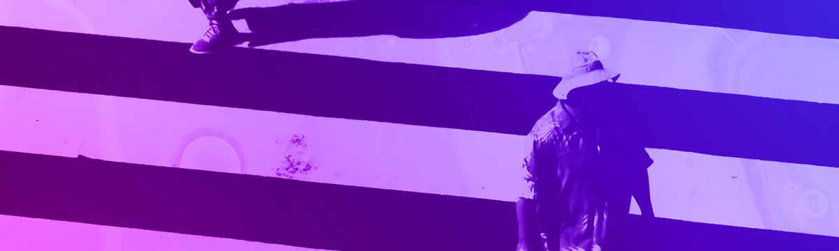 Two people on a zebra crossing with blue to purple colour hue.