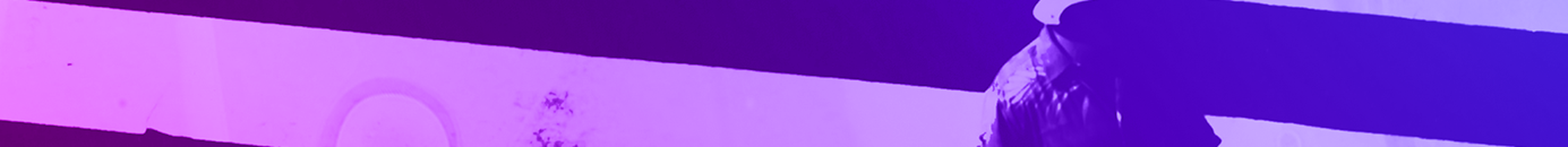 Two people on a zebra crossing with blue to purple colour hue.