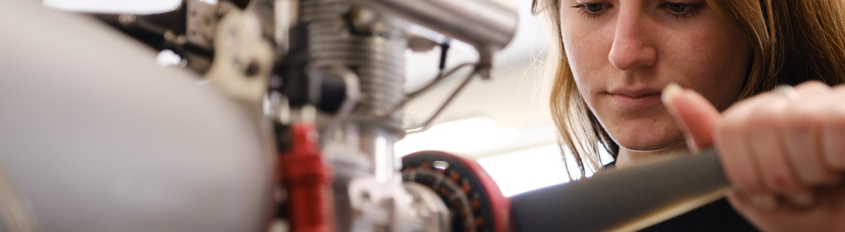 A female employee working on a rotor.