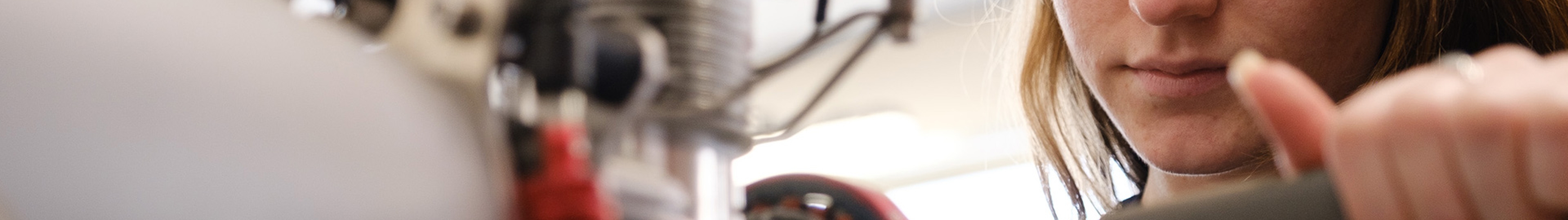 A female employee working on a rotor.