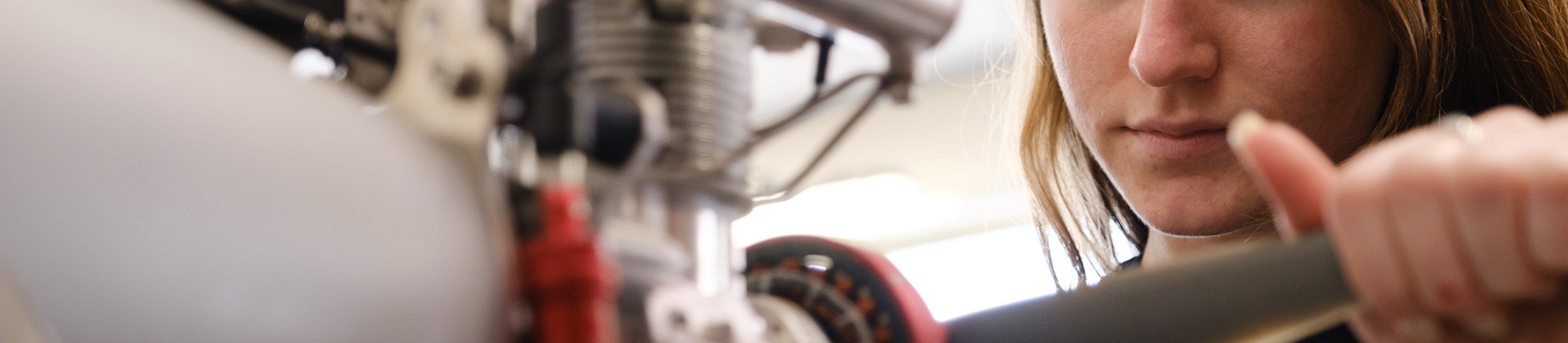 A female employee working on a rotor.