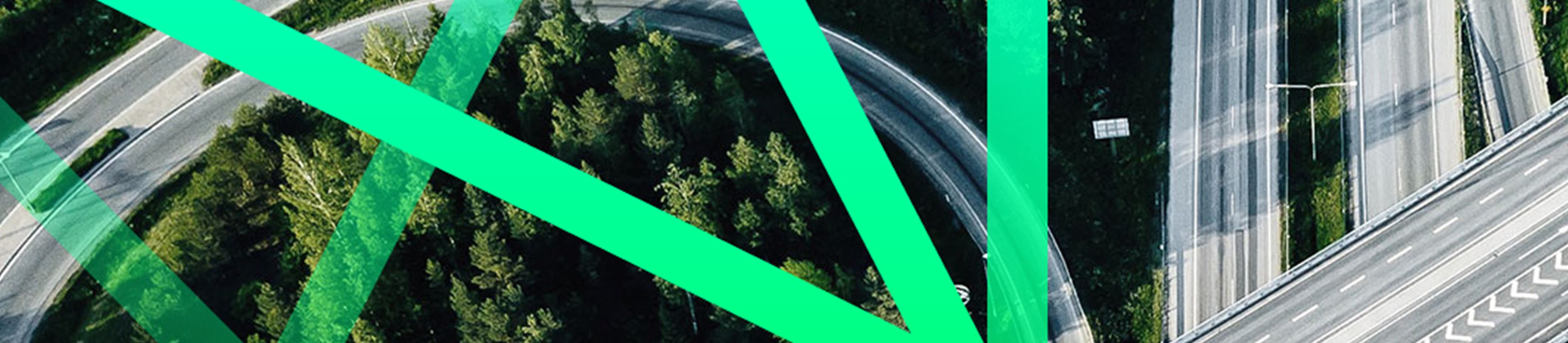 Birds-eye view of motorway with a green abstract graphic overlayed.