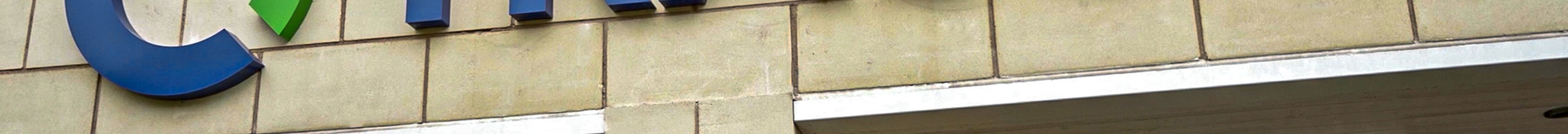 The Tracsis logo on a building.
