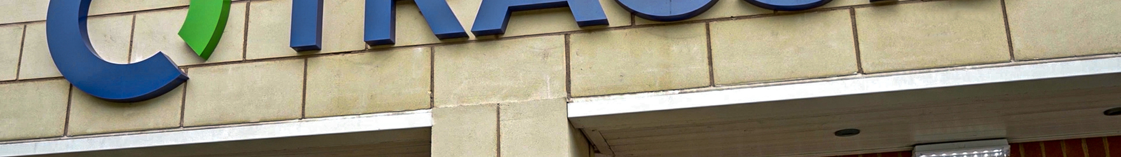 The Tracsis logo on a building.