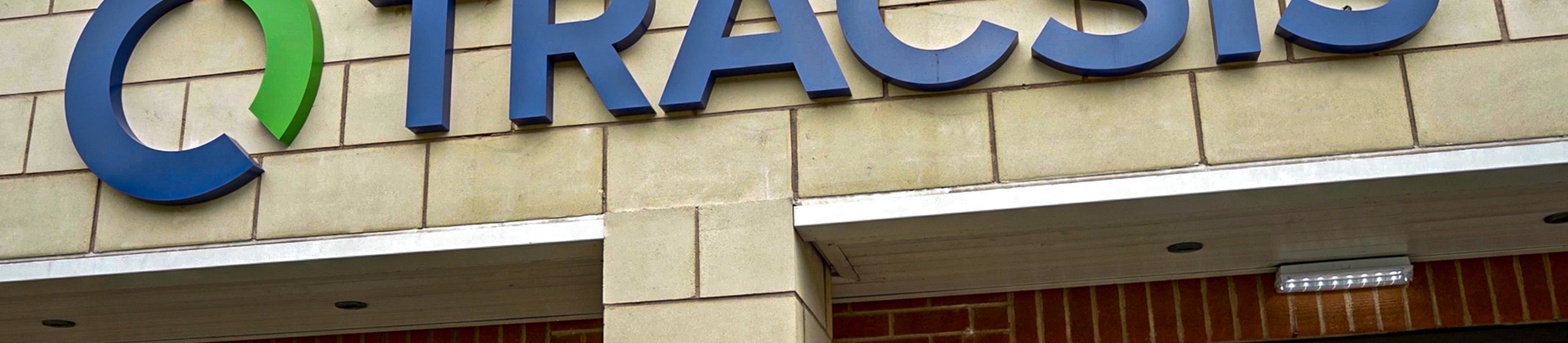 The Tracsis logo on a building.