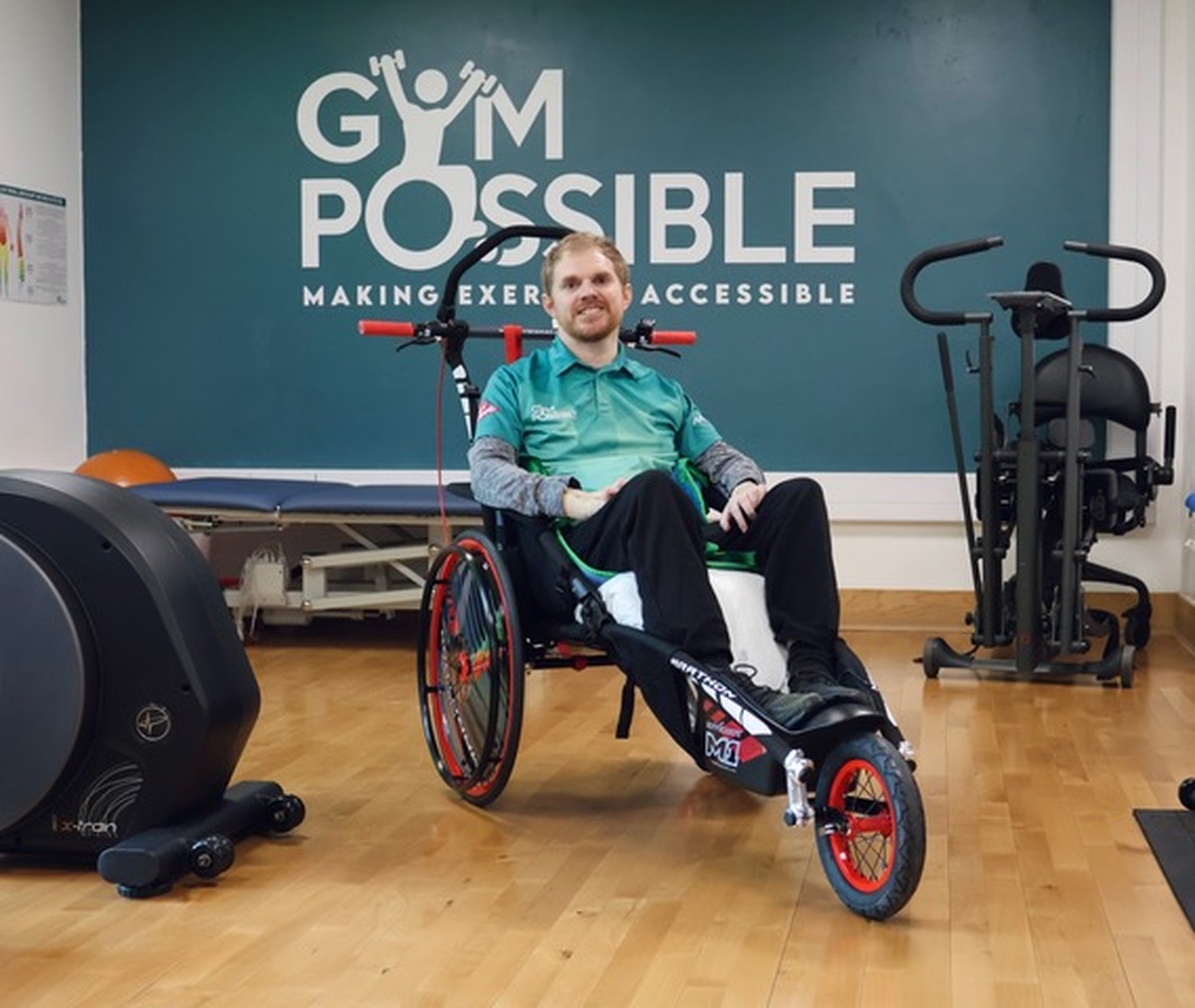 a man in a wheelchair attends an adapted gym