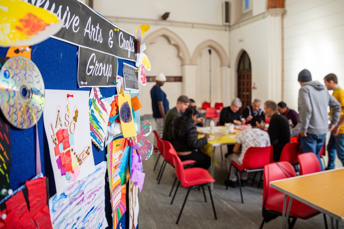 a group of adults engage in an arts and crafts group at Ascension Community Trust