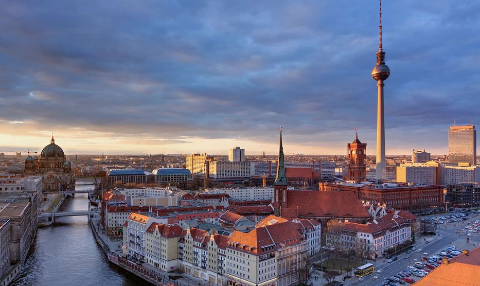 Photo of the city of Berlin showing famous landmarks such as the television tower and the River Spree.