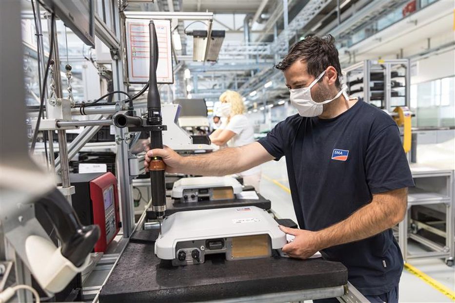 SMA employee at the production line