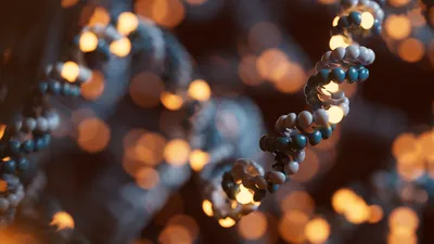 An animation of a DNA strand with glowing orange bases