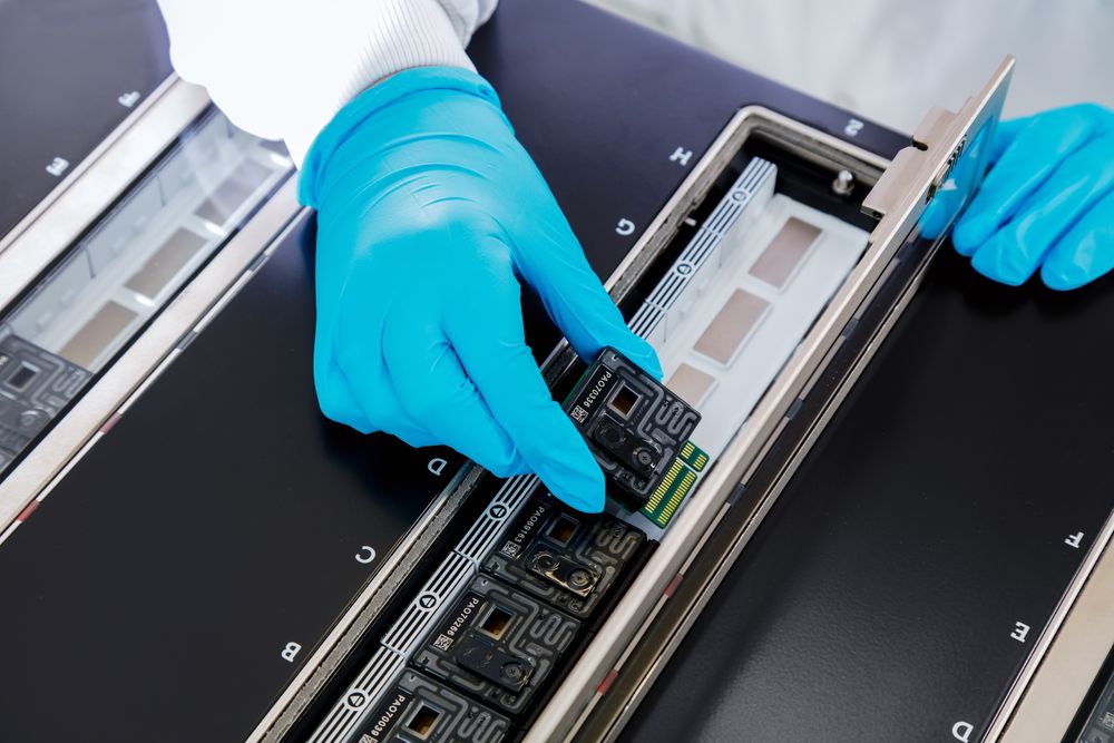 PL006c PromethION FC being inserted in a PromethION 24 - Option 2