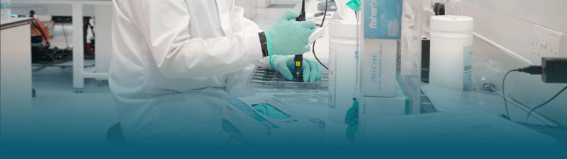 Lab with scientist using pipet