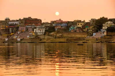 photograph of sun setting over River Ganges