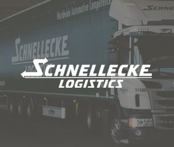 A large truck with a "Schnellecke Logistics" logo prominently displayed on both the truck and the backdrop.