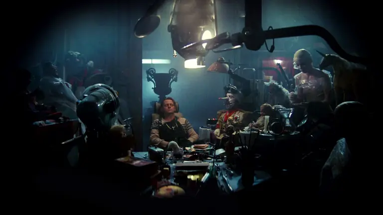 Group of people surrounded by mechanic objects