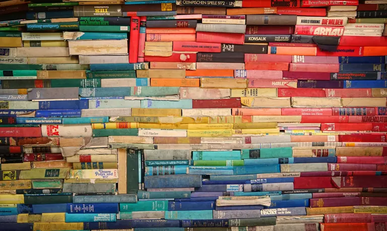 colorful old books stacked in a pile