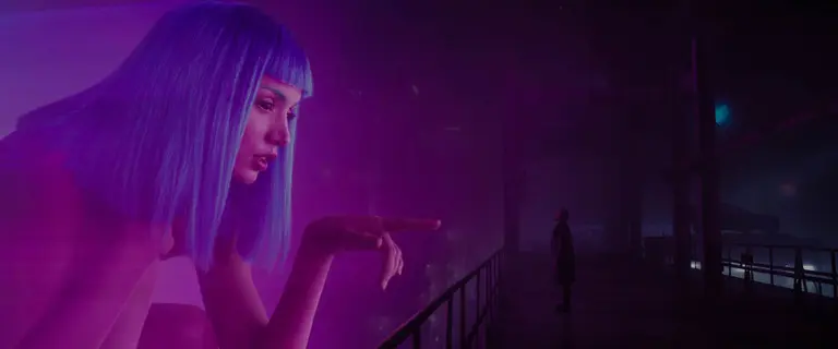 Female giganting hologram pointing her finger at a man