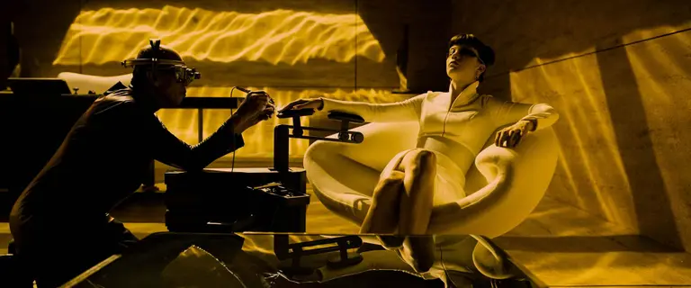 Woman getting her nails done by a male nail technician
