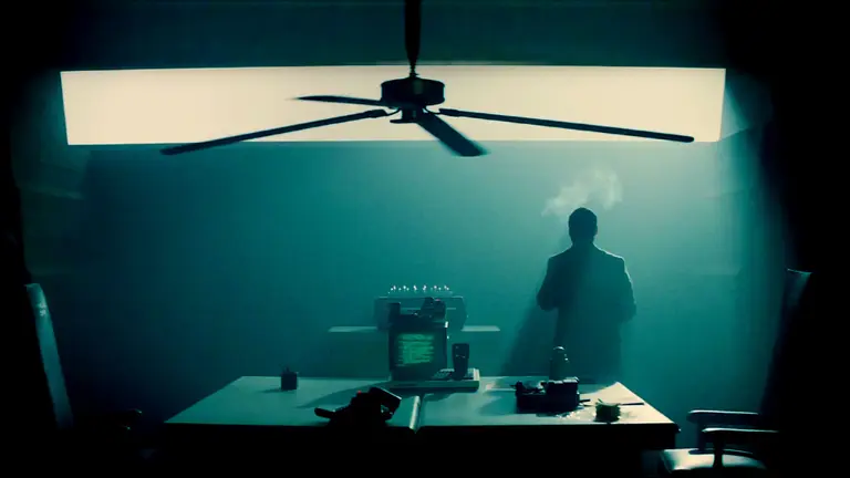 Silhouette of a man standing in an office
