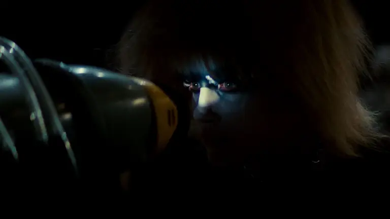 Woman looking through a looking glass