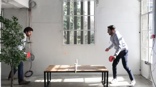 Team playing ping pong