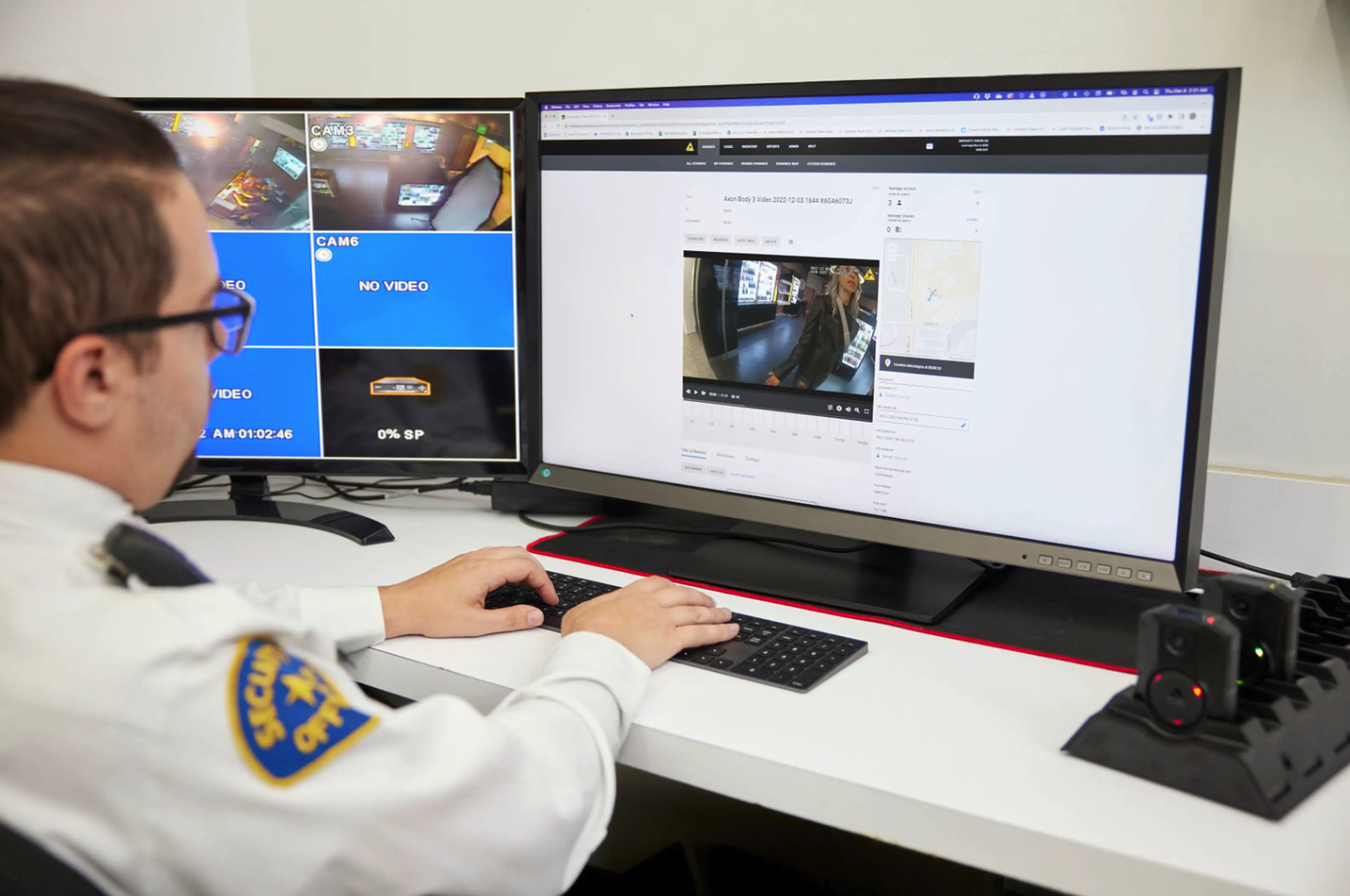 Security officer on a computer.