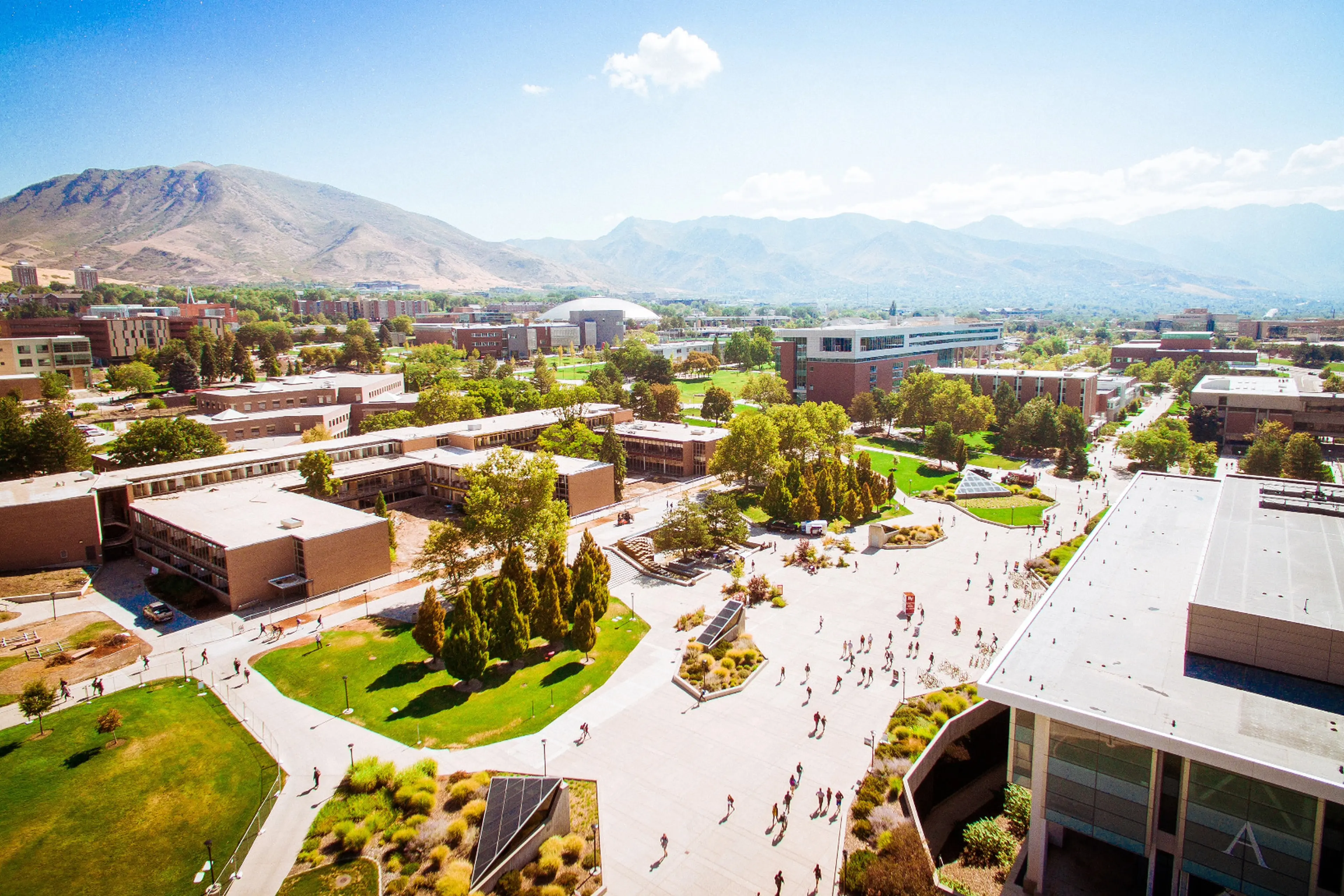 An aerial shot of The University of Utah with students roaming the grounds.