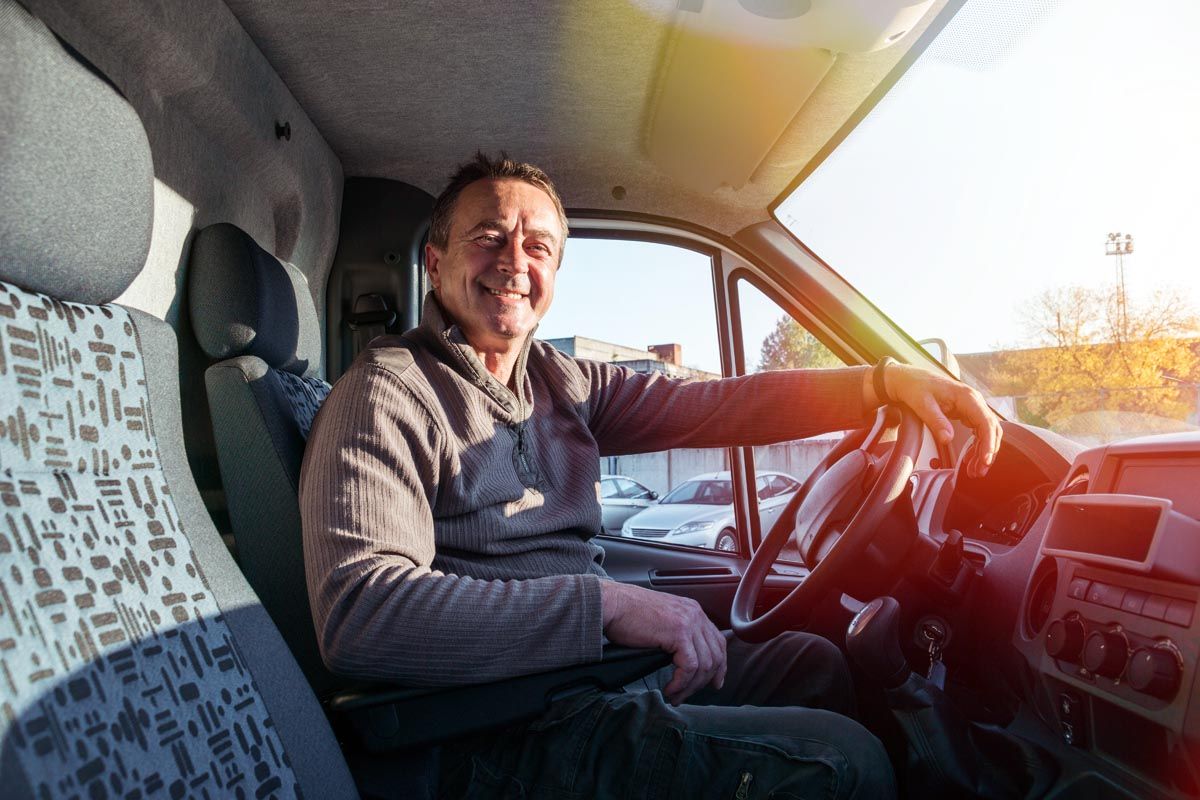 Tiptapp helper sitting in a van