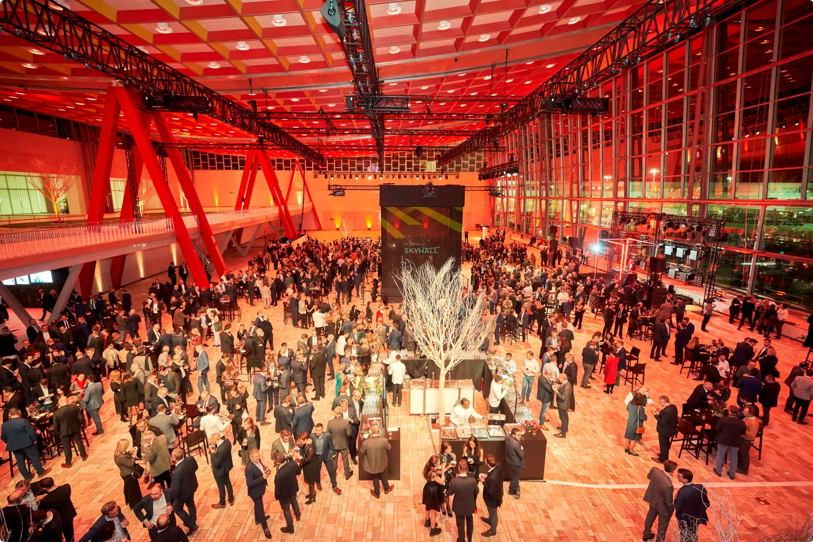 Spacious venue with people networking with big window