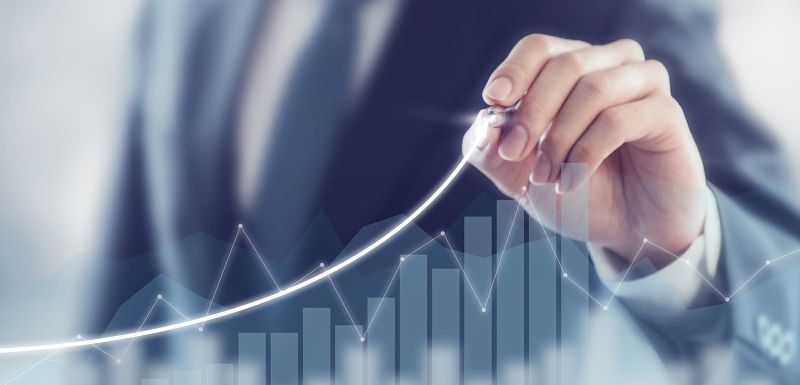 Business growth chart. A hand drawing on a chart displaying business growth.