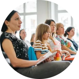Image of women all seated in a row 