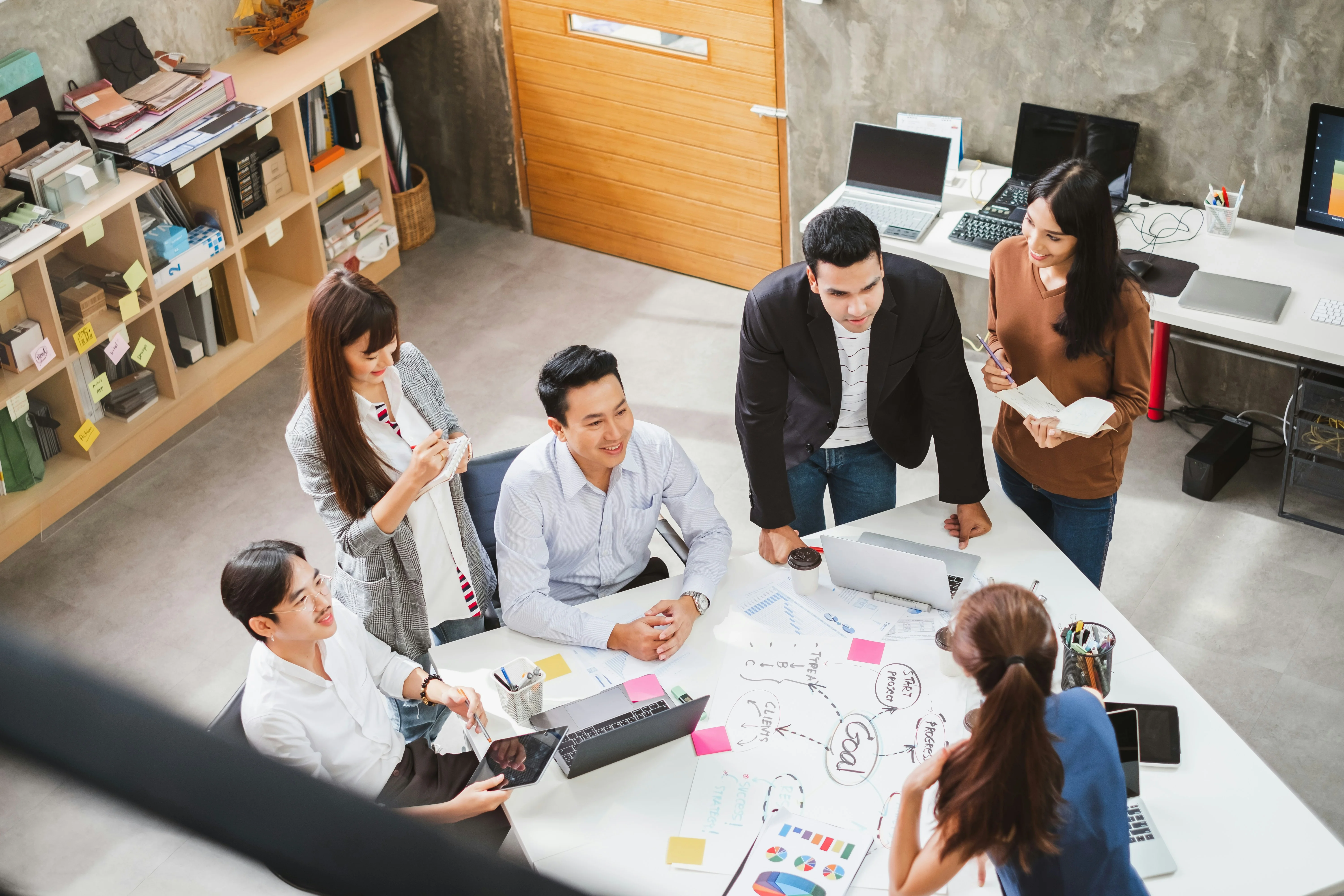 company meeting discussing what are the best eor services