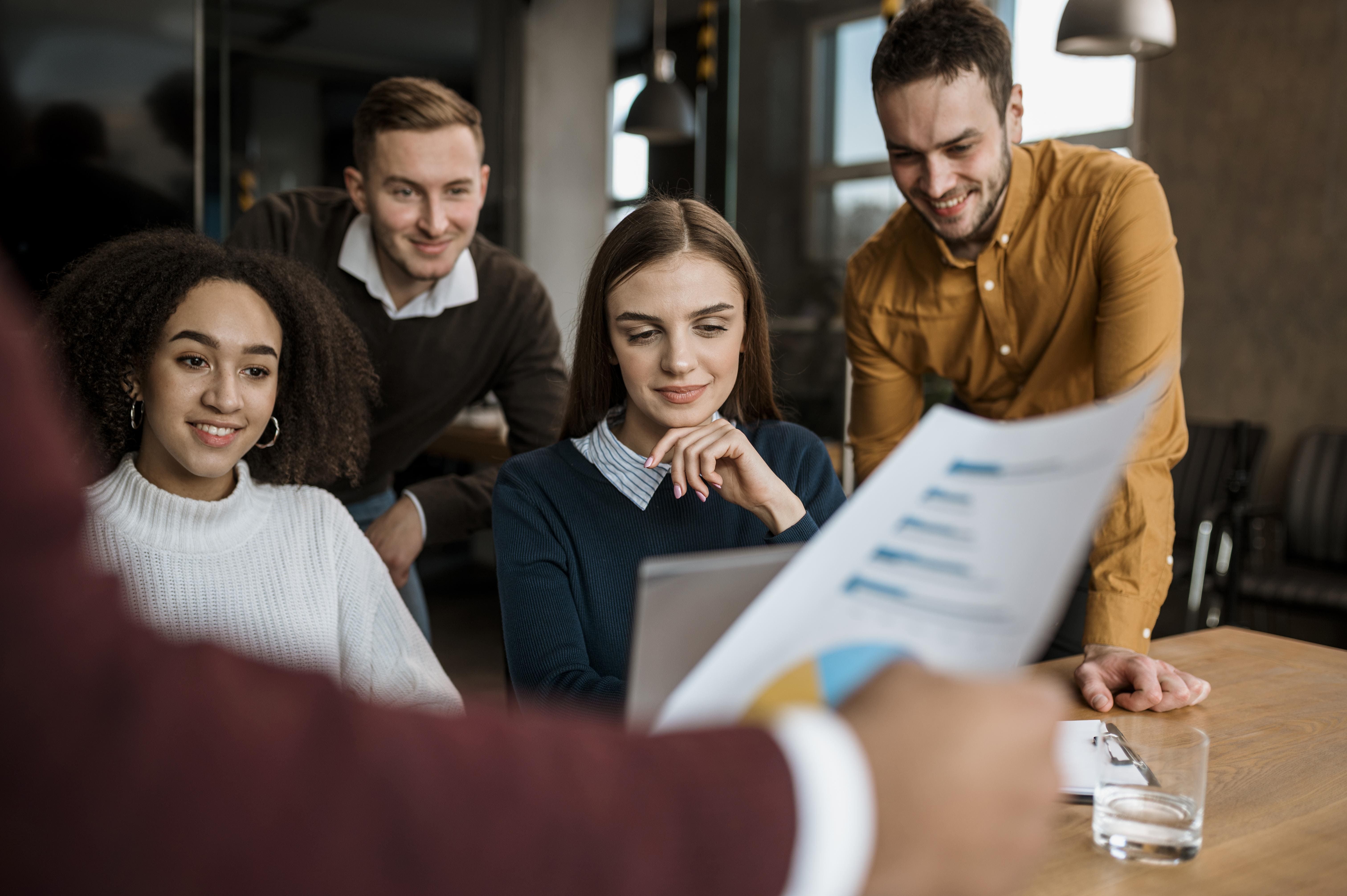 smiley colleagues having meeting office