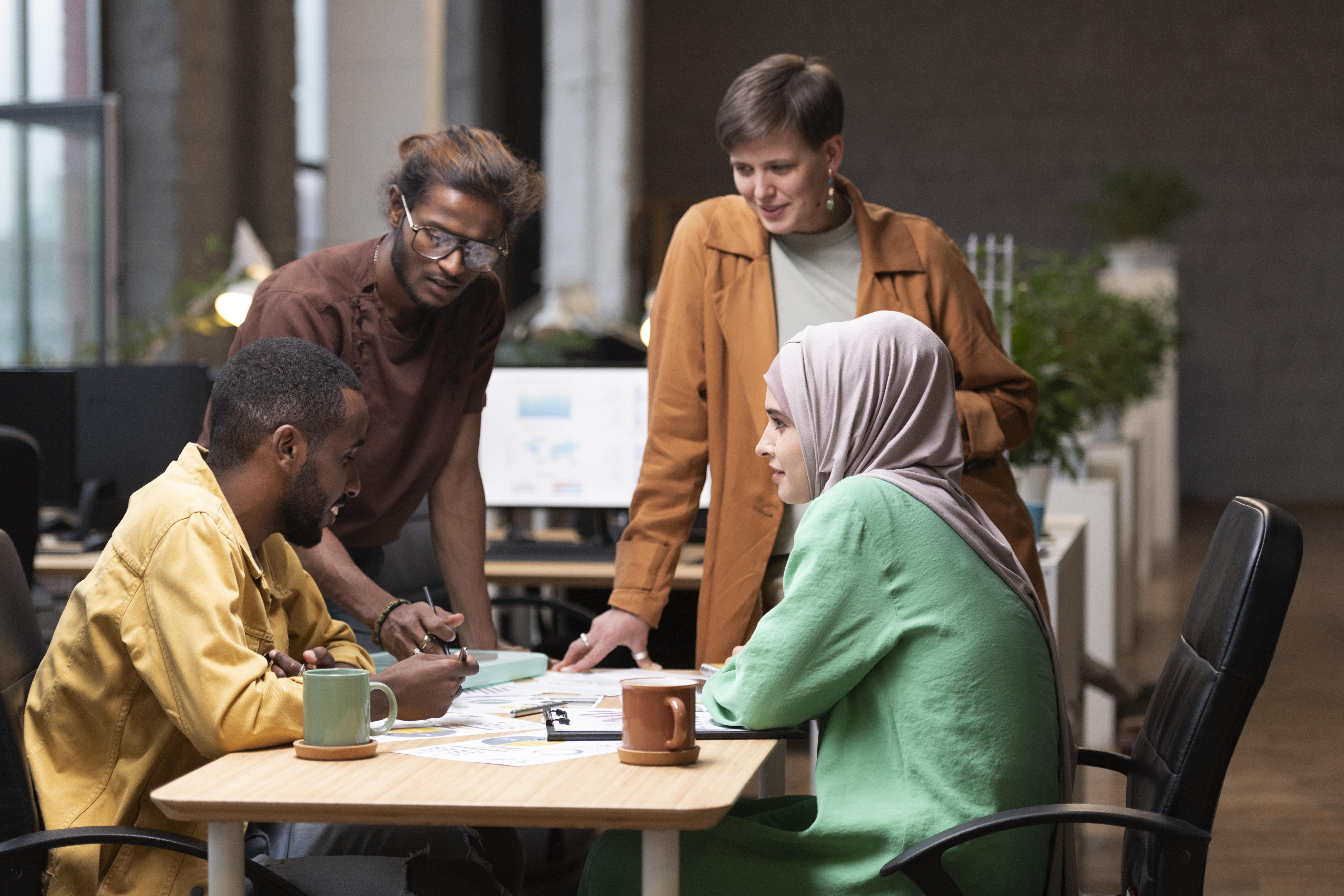 medium shot colleagues having meeting